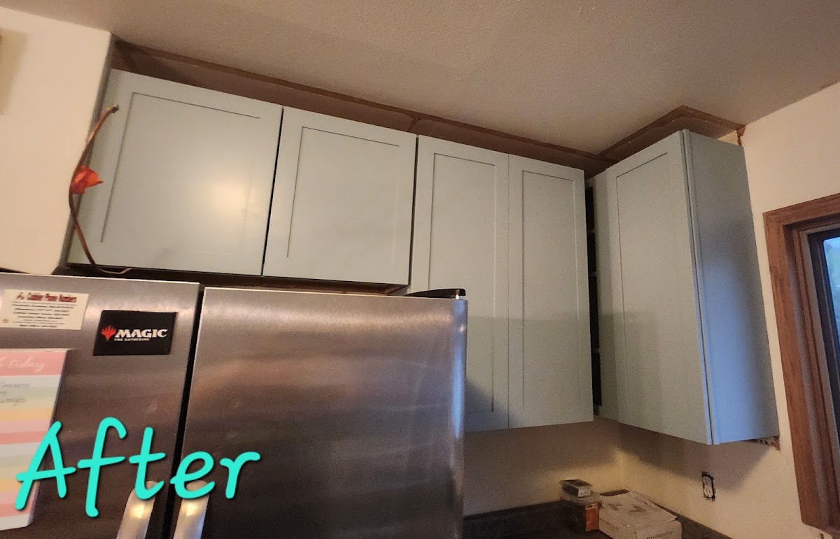 Kitchen with freshly painted cabinets, after the update